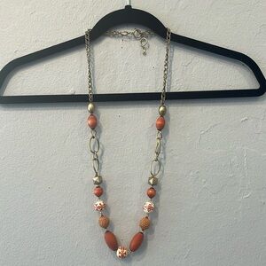 Gold necklace with orange beads